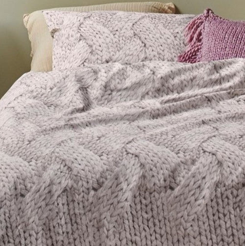 Close-up of Tricot duvet cover showing detailed knit pattern in ivory and taupe on cotton fabric