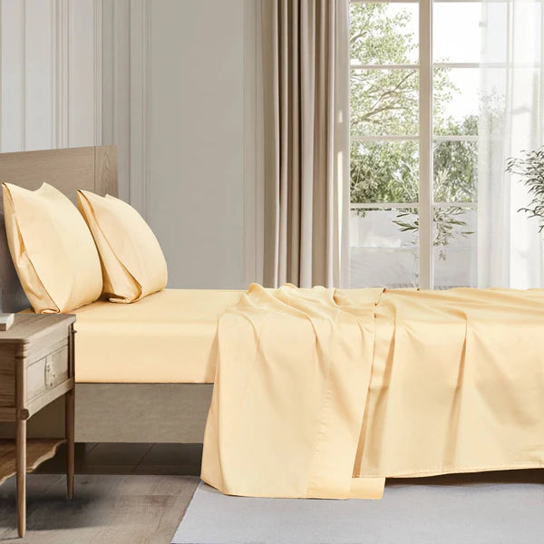 Flat lay of organic cotton sheet set in white, breathable and certified organic