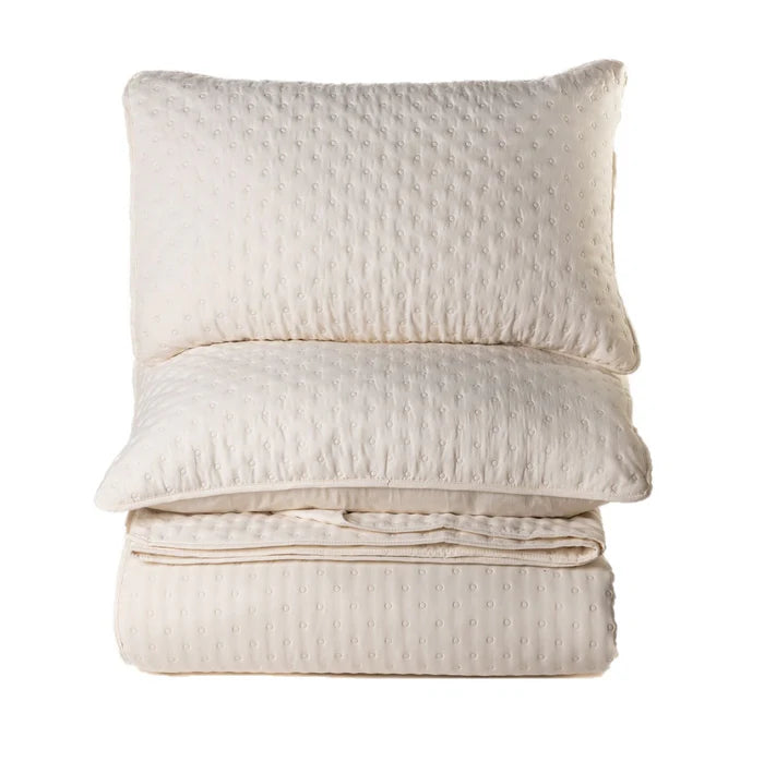 Polka Quilt Set in Cream – Embossed polka dot microfiber, shown flat
