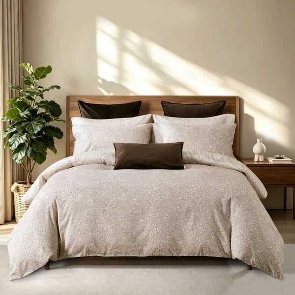 Sable duvet cover set with a neutral animal-inspired print and coordinating pillowcases styled on a wooden bed.

