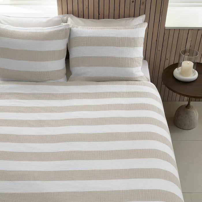 Close-up of natural stripe cotton muslin duvet cover with zipper detail