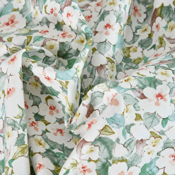Close-up of Teryn duvet cover set showing 200 thread count cotton floral print with terra cotta and white flowers